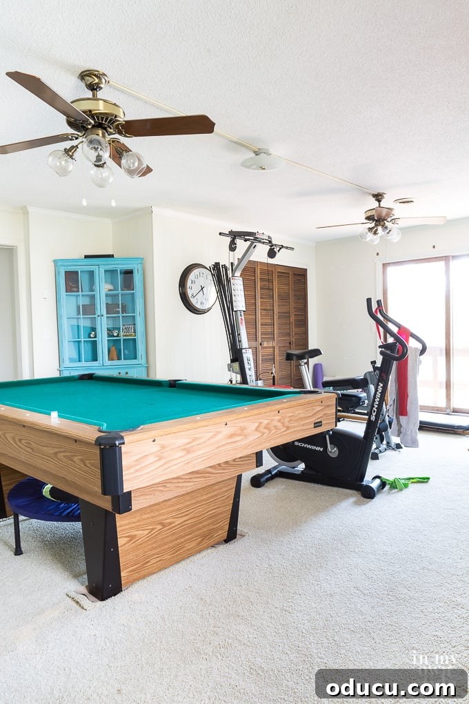 The Inaccessible Game Den 3 Initial state of the lake house game room before any makeover, highlighting its potential for transformation.