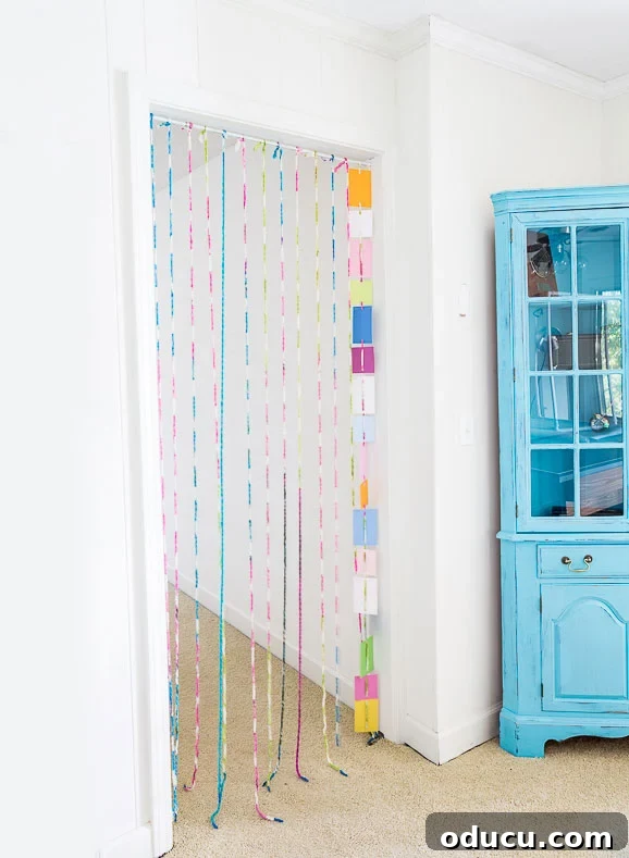 Palette Chip Portal Curtain 11 Creative DIY paint chip crafts and decor for a room in your home.