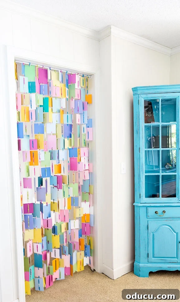 Palette Chip Portal Curtain 15 How to make a colorful curtain for a doorway using paint chip swatches.