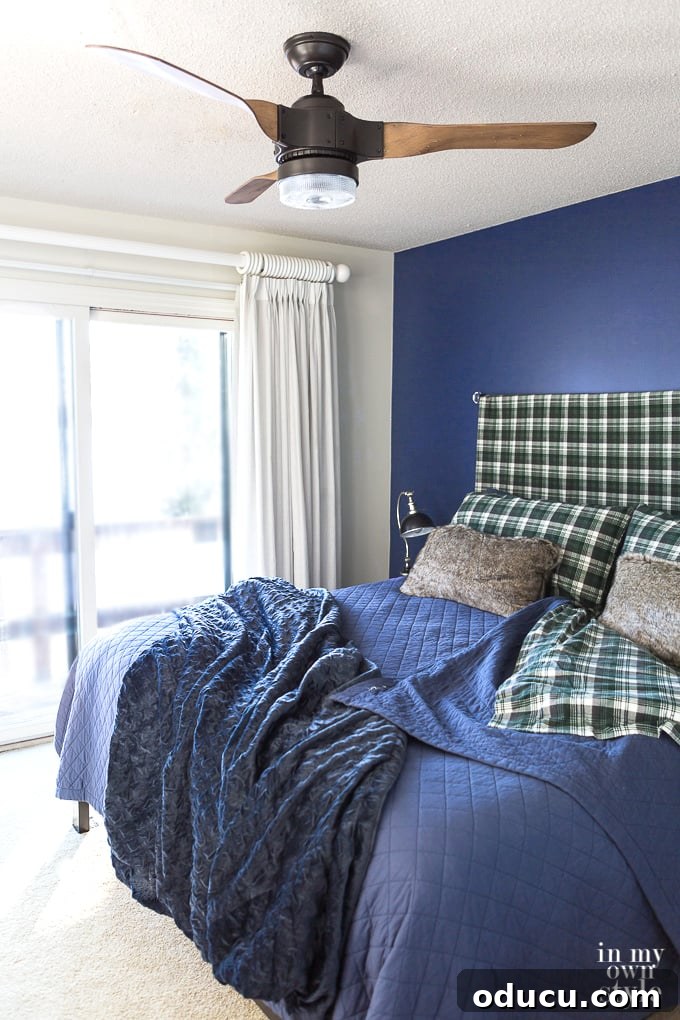 Magnolia Home Chalk Finish Nightstand 4 Navy-blue-accent-wall-in-bedroom with white accents
