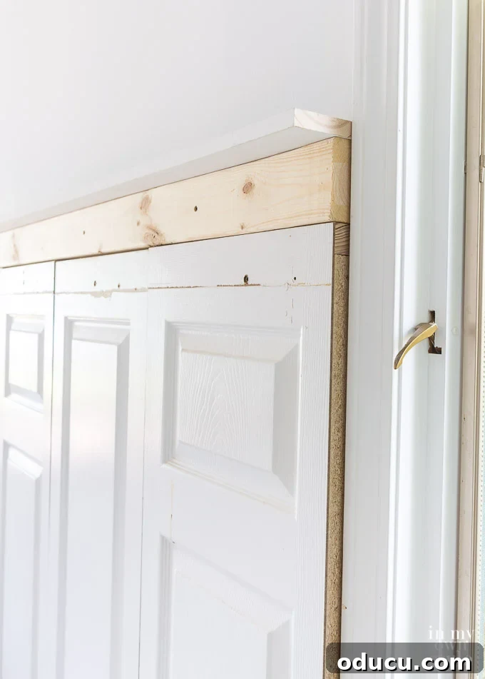 Creating a headboard using old doors and combining them with stock molding