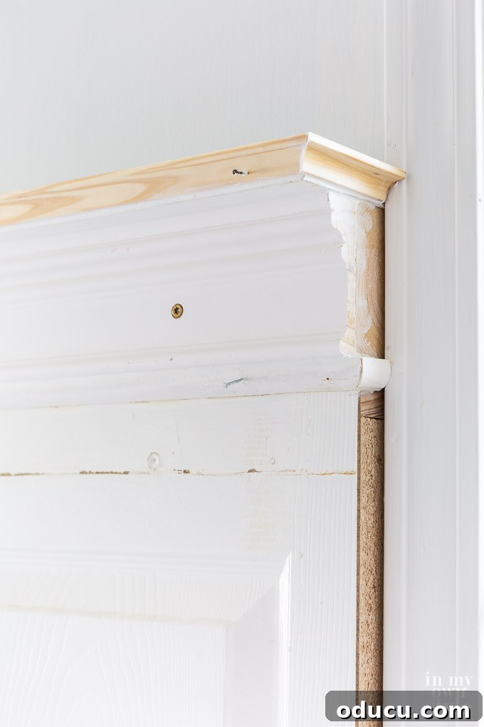 Innovative wood molding ideas to finish the top of a bed headboard crafted from old doors