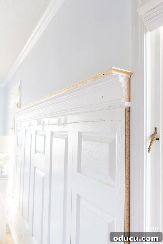 Detailed photo tutorial demonstrating how to construct a headboard from old doors