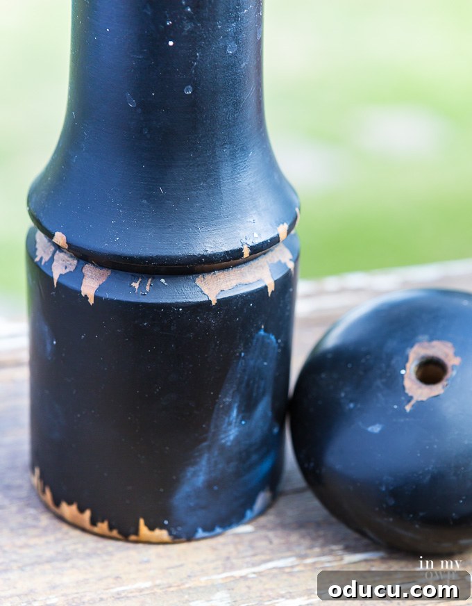 Everyday Magic in Miniature Moments 3 An old and chipped wooden pepper mill, showcasing its wear and tear, poised for a transformative DIY makeover with a fresh coat of paint.