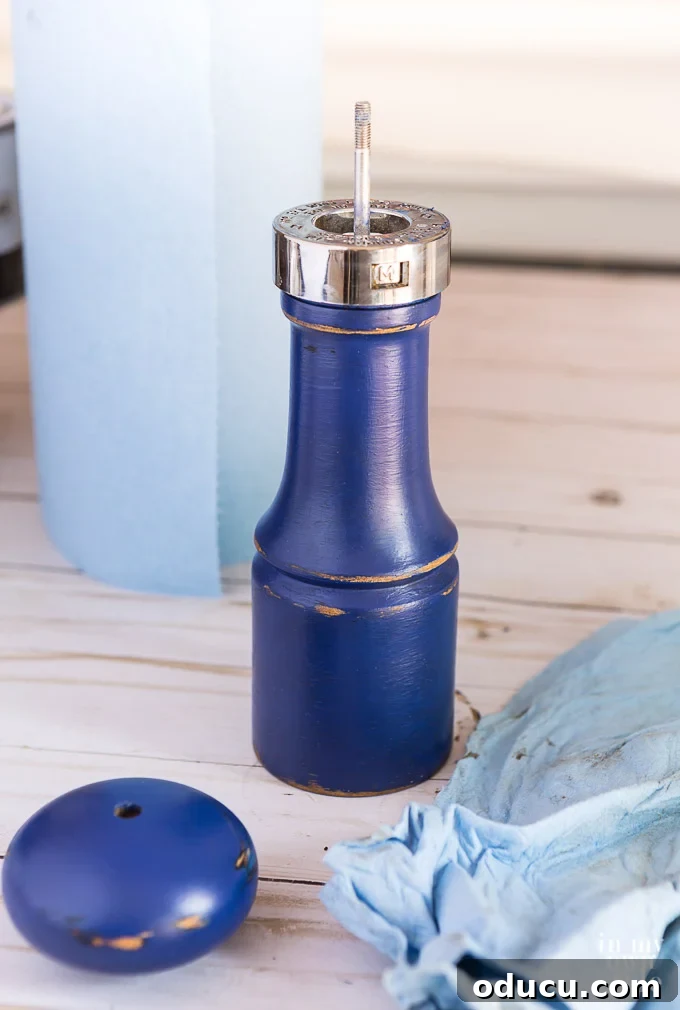 Everyday Magic in Miniature Moments 7 Detailed instructions on how to use leftover latex or craft paint to change the color of a pepper grinder or pepper mill, offering a personalized touch.