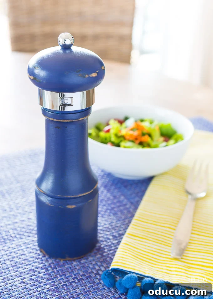 Everyday Magic in Miniature Moments 8 A beautifully painted navy blue pepper grinder, demonstrating how to paint any small wooden object with chalk paint to match your home decor.