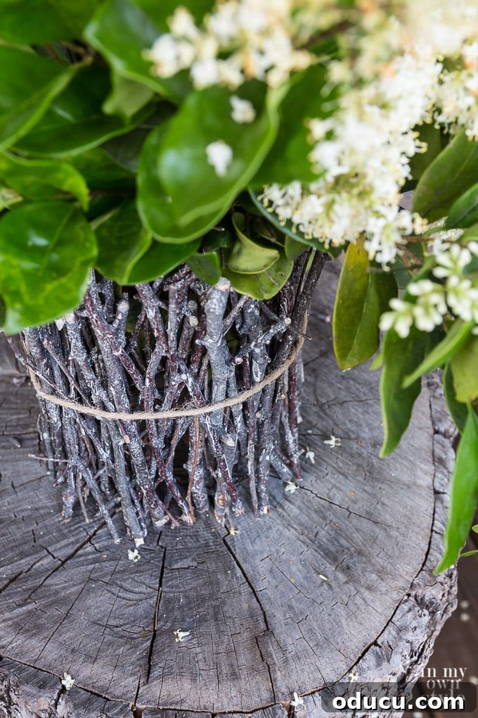 Handcraft a Rustic Twig Vase 7 DIY rustic twig vase tied with twine