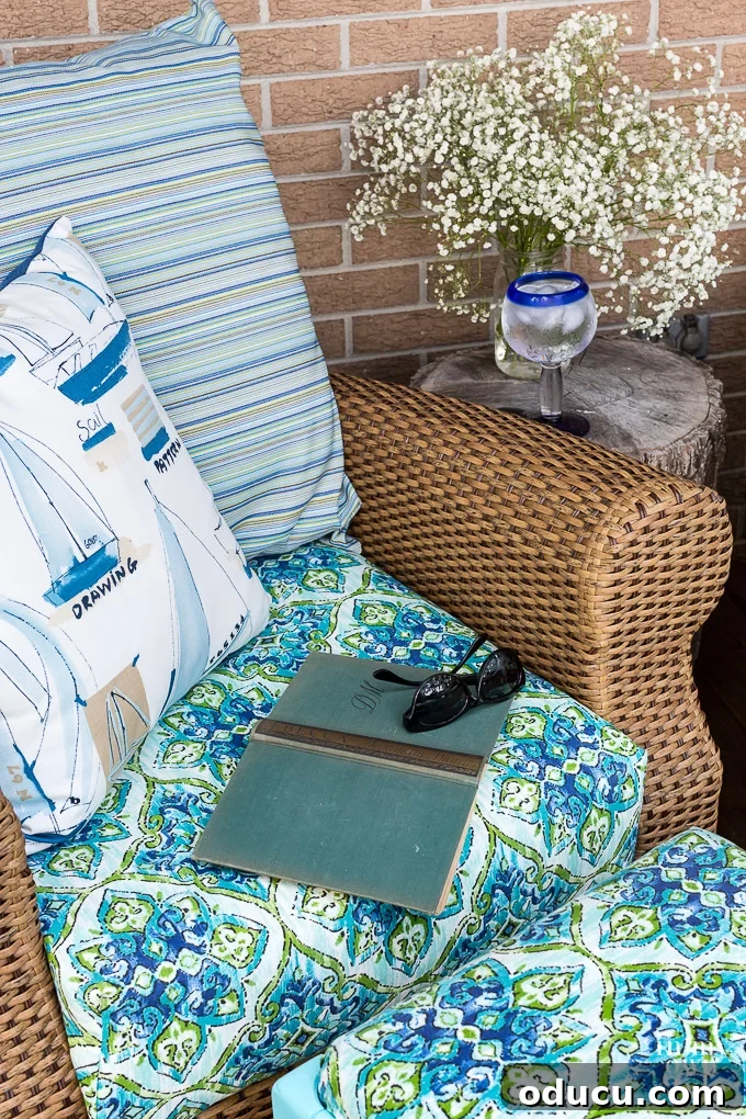 From Neglected Stool to Elegant Ottoman 3 Relaxing on rattan rocking chairs on a deck with outdoor cushions and pillows, an open book, and a temporary ottoman.