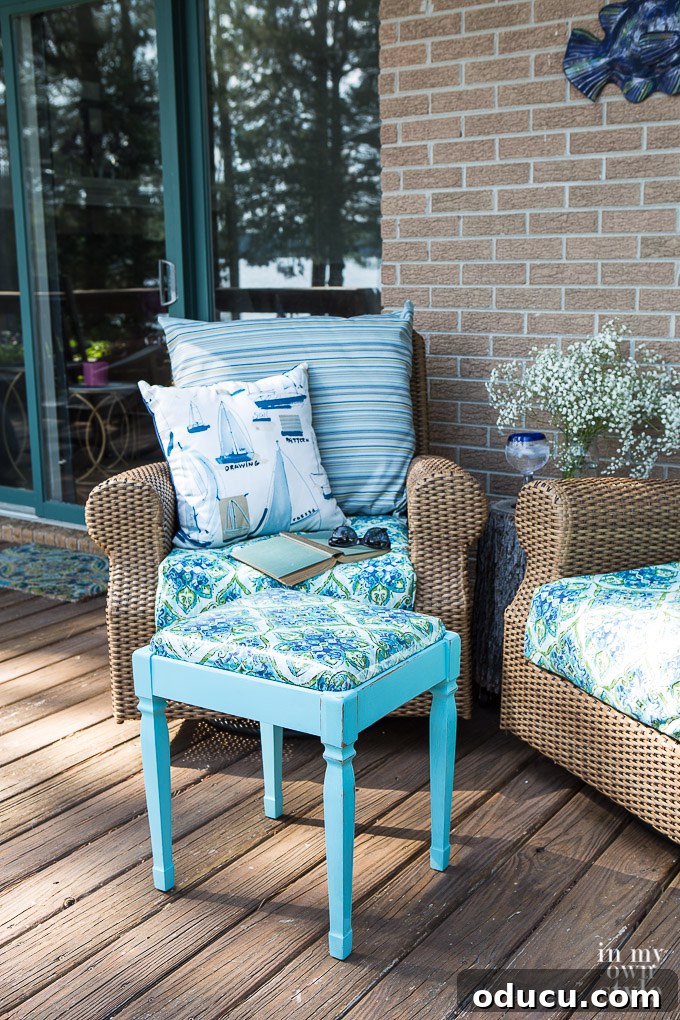 From Neglected Stool to Elegant Ottoman 5 Completed small square stool, painted turquoise with green fabric and a clear iron-on lamination for water protection.
