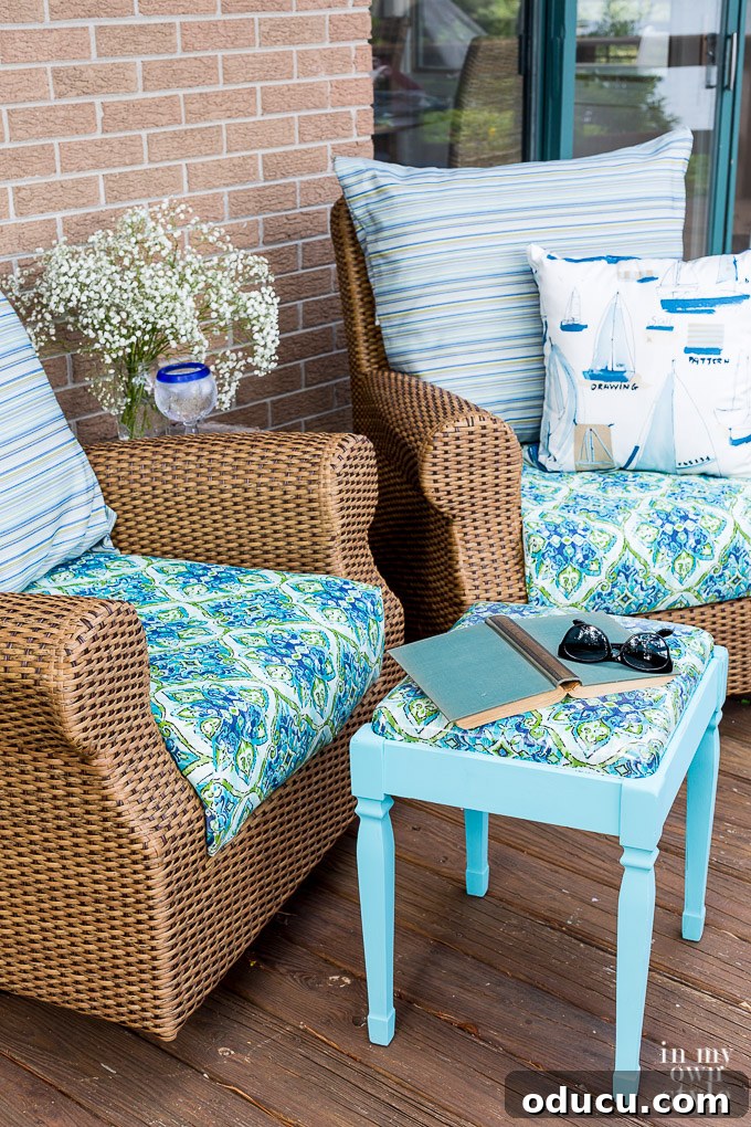 From Neglected Stool to Elegant Ottoman 8 Two rattan rockers with the newly transformed stool placed between them, creating a cozy outdoor seating arrangement.