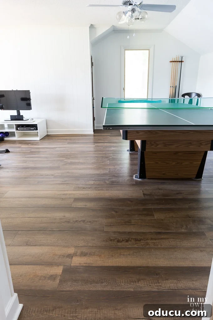 Pool table on furniture sliders over newly installed LVP flooring