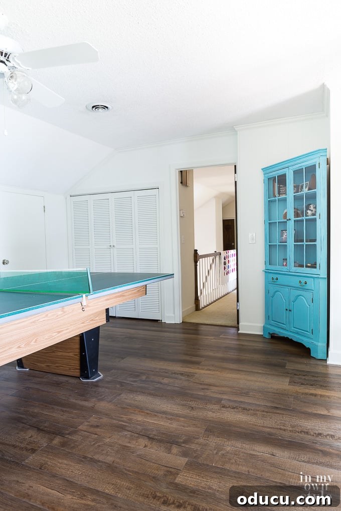 Pool table with light wood accents on new LVP flooring