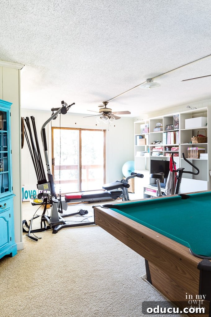 Dated game or spare room with wall to wall carpet