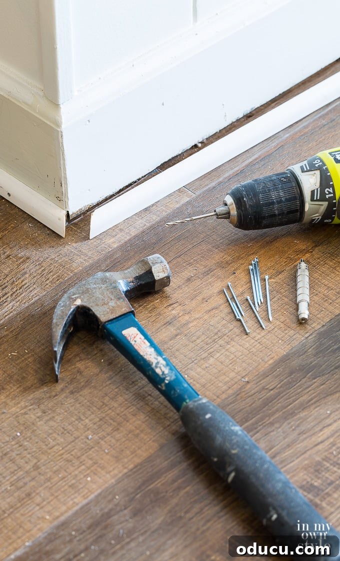 Transition strip connecting LVP flooring to another type of floor