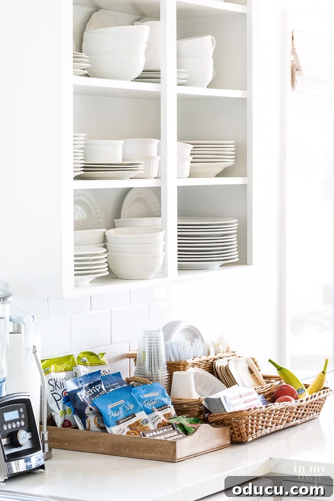 Kitchen Snacks ideas and entertaining tips for overnight guests. #entertaining #guestroom #kitchen #overnight #food #snackideas Kitchen counter brimming with snacks and food ideas for overnight guests