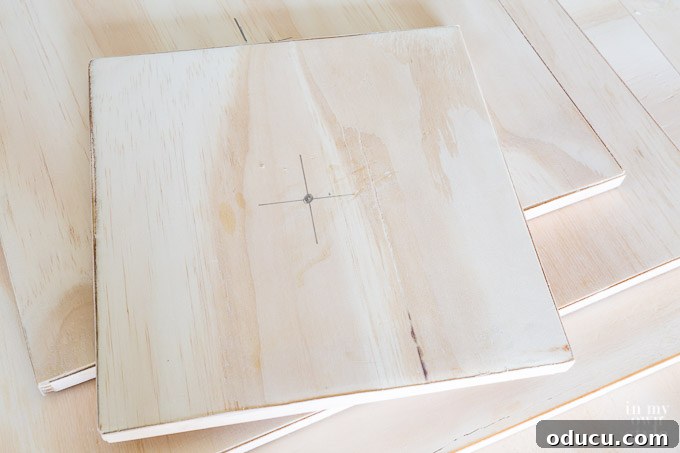 Build a Stunning Stacked Donut Wedding Centerpiece 22 Drilling a pilot hole into the center of a plywood board