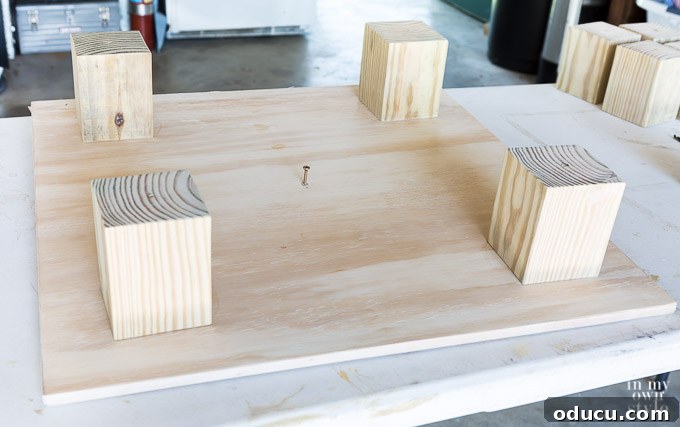 Build a Stunning Stacked Donut Wedding Centerpiece 27 Attaching a wooden foot block to the largest board