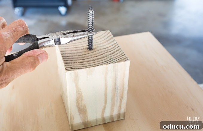 Build a Stunning Stacked Donut Wedding Centerpiece 31 Inserting a dowel screw into a riser block