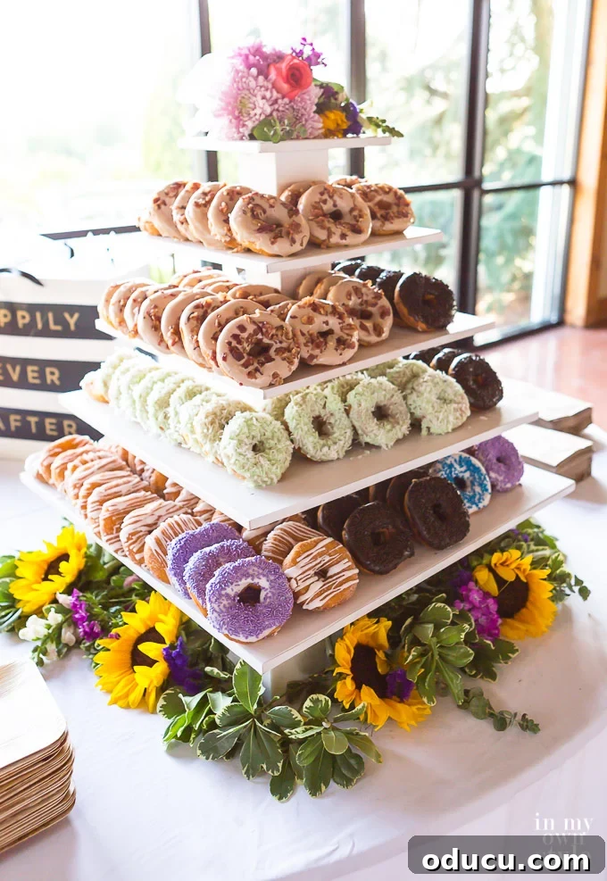 Build a Stunning Stacked Donut Wedding Centerpiece 39 Beautifully decorated DIY donut stand at a wedding reception