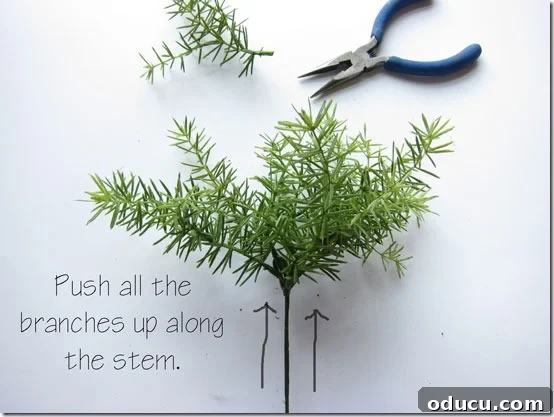 Craft Your Own Lifelike Topiary 9 Pushing all the artificial greenery branches up to the stop on the wire stem.
