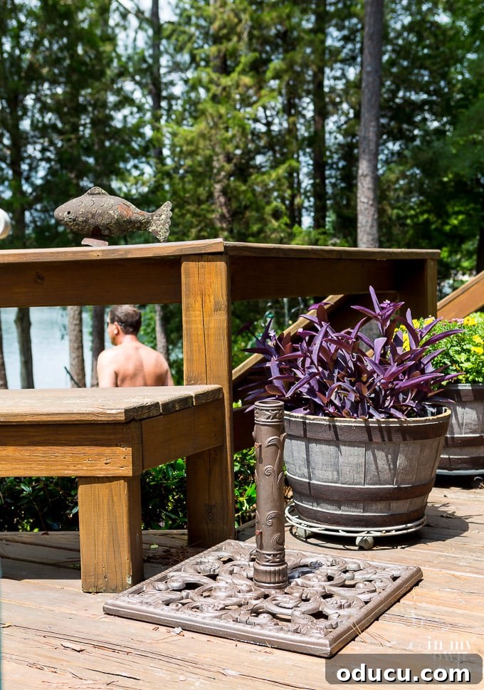 Painting metal outdoor furniture tips and techniques Newly spray painted outdoor umbrella stand on lakeside deck.