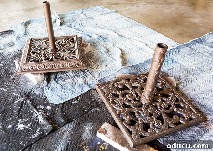 The best spray paint to use when restoring metal outdoor furniture and accessories. Two metal umbrella stands after being spray painted with Rustoleum Hammered spray paint.