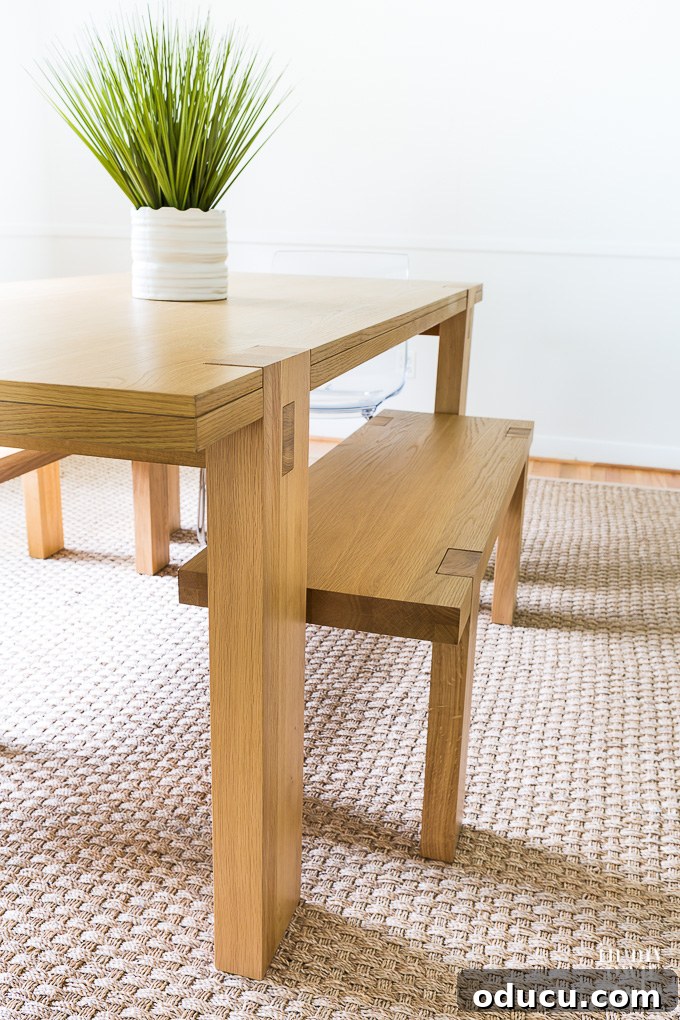 West Elm dining table and benches, showcasing modern, minimalist dining furniture in a refined space.