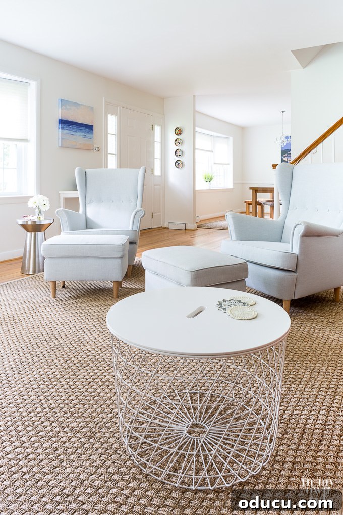 White furniture from IKEA, including a sofa and coffee table, contributing to the bright and modern living room design.