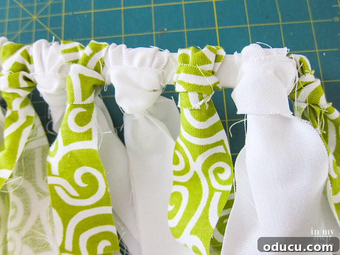 Fabric strips tied on curtain rod