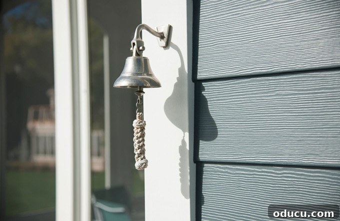 Hardie Plank lap siding featuring an authentic cedar wood texture Silver bell on house with Hardie plank siding, highlighting texture