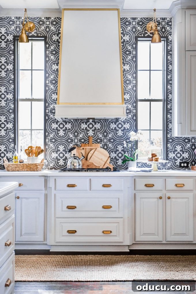 Hi Sugarplum kitchen showcasing black and white patterned wall tiles Stylish kitchen with patterned black and white tiles on the walls by Hi Sugarplum