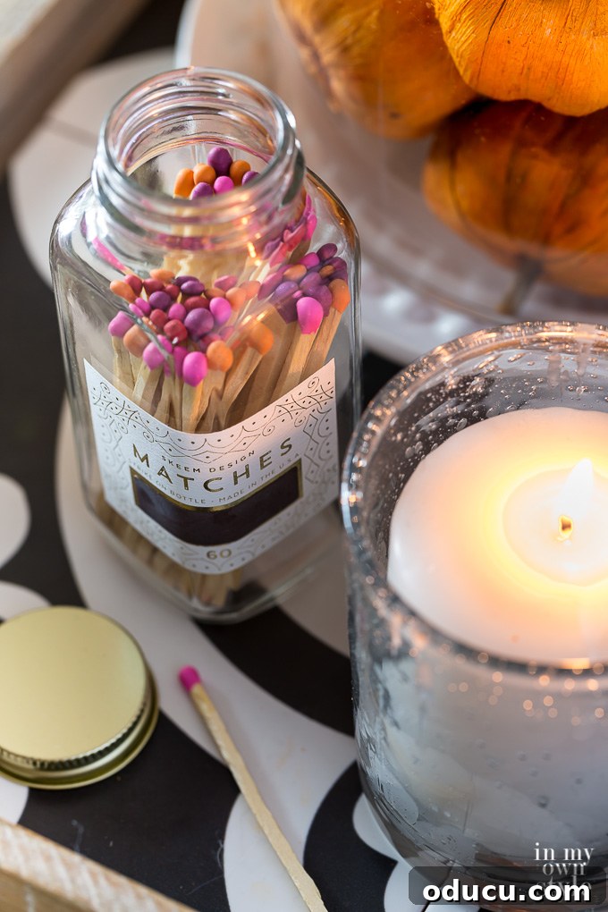 Effortless Fall Comfort: Cozy Decorating Ideas for Your Home 15 Pink and orange tipped matches on table next to a lit candle