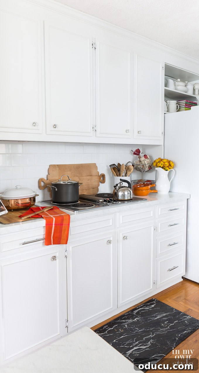 Effortless Fall Comfort: Cozy Decorating Ideas for Your Home 17 White kitchen decorating using fall colors and a wood bread board