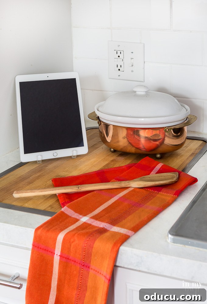 Effortless Fall Comfort: Cozy Decorating Ideas for Your Home 19 Ipad and copper soup pot on kitchen counter, adding warm shine