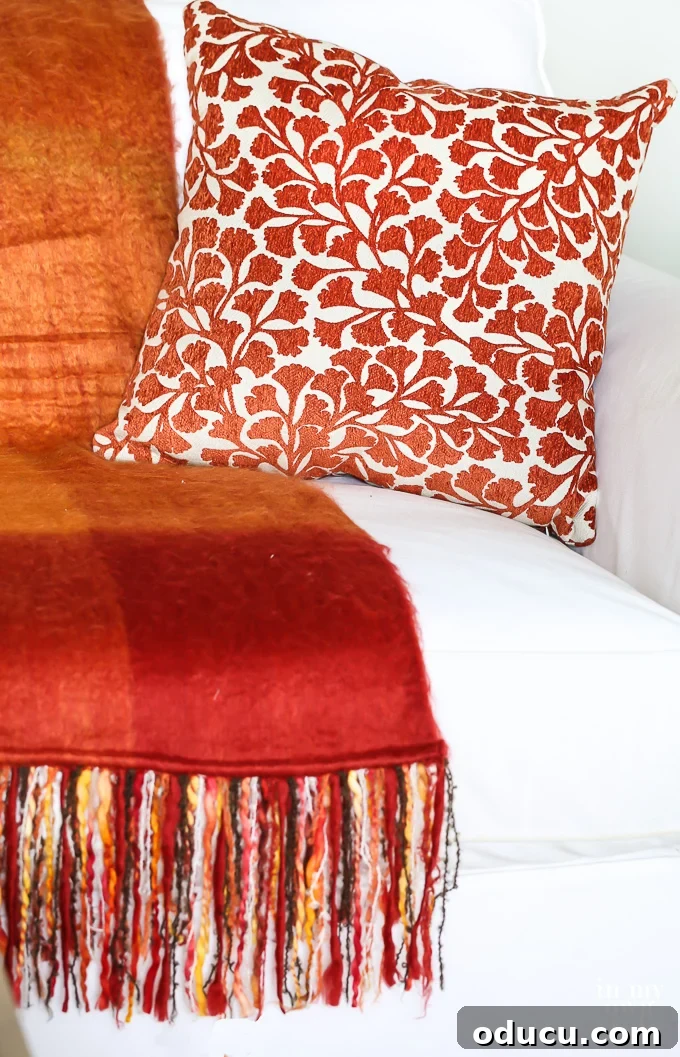 Effortless Fall Comfort: Cozy Decorating Ideas for Your Home 8 Fall orange and rust decorative accessories including soft throws and pillows