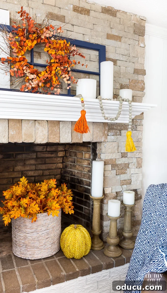 Materials for DIY Fall Wood Bead Garland with Driftwood Finish and Raffia Tassels A comprehensive collection of supplies laid out for making a fall-themed wood bead garland, including stained beads, raffia, and string.