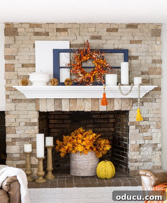 Autumn inspired mantel and fireplace decorating idea White mantel decorated for fall.