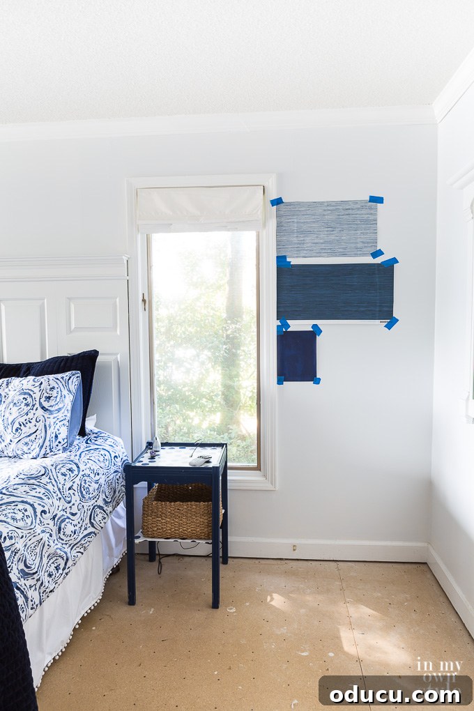 Blue and white bedroom decorating ideas to consider Blue and White wallpaper swatches on wall