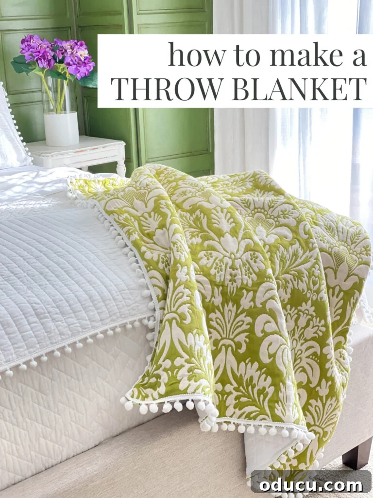 DIY Fabric Throw Blanket: So Easy, So Pretty 5 Green and white pom-pom trimmed throw draped over the end of a bed. Text overlay says - how to make a throw blanket
