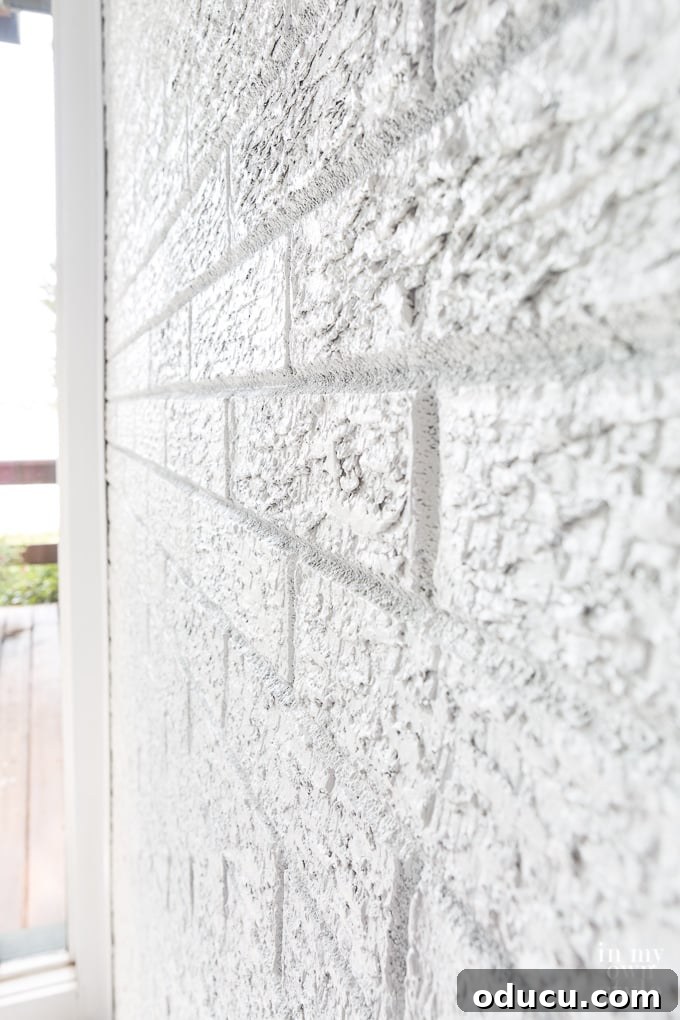 Close up of a white painted brick wall