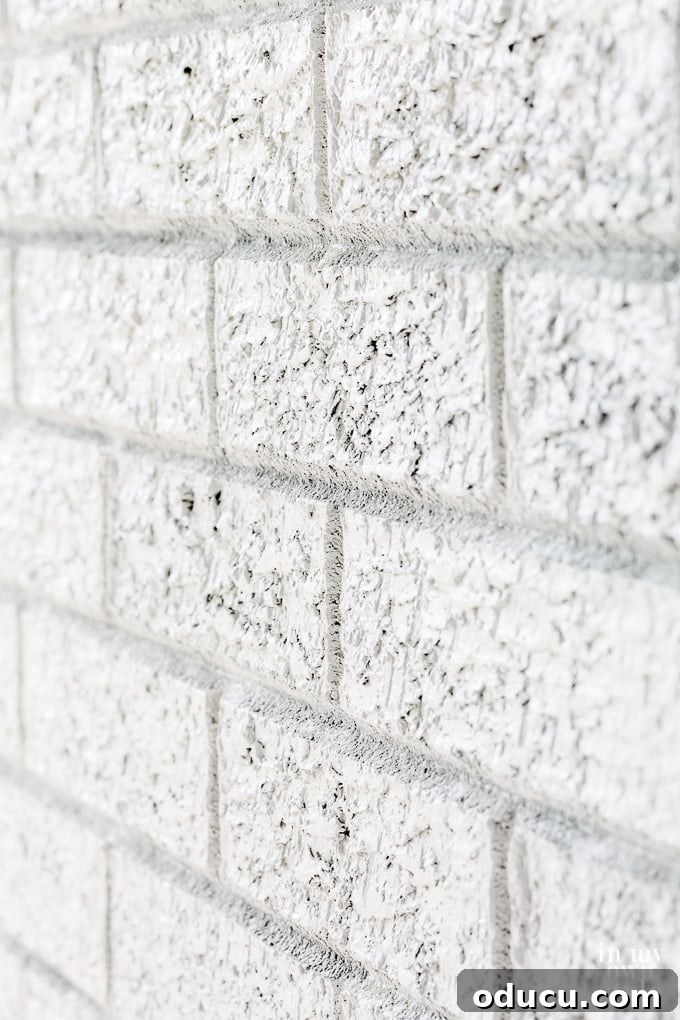 close up of white painted brick wall