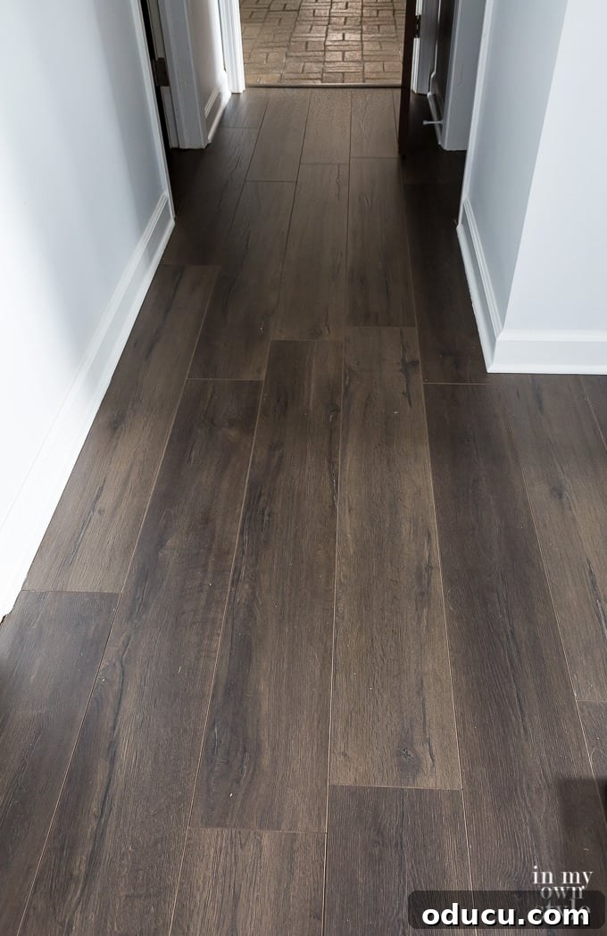 Floor Makeover: From Carpet to Laminate Wood 6 Close-up of a doorway area, showing the precise fit of laminate flooring.
