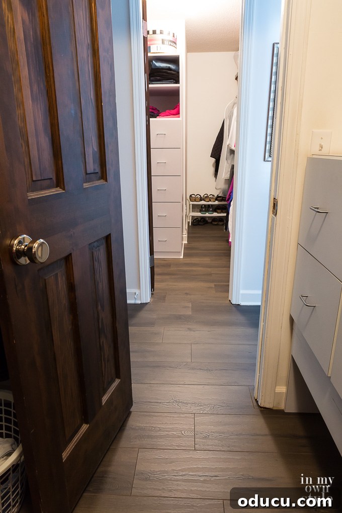Floor Makeover: From Carpet to Laminate Wood 8 A finished laminate floor section showing the precise cuts around a doorframe.