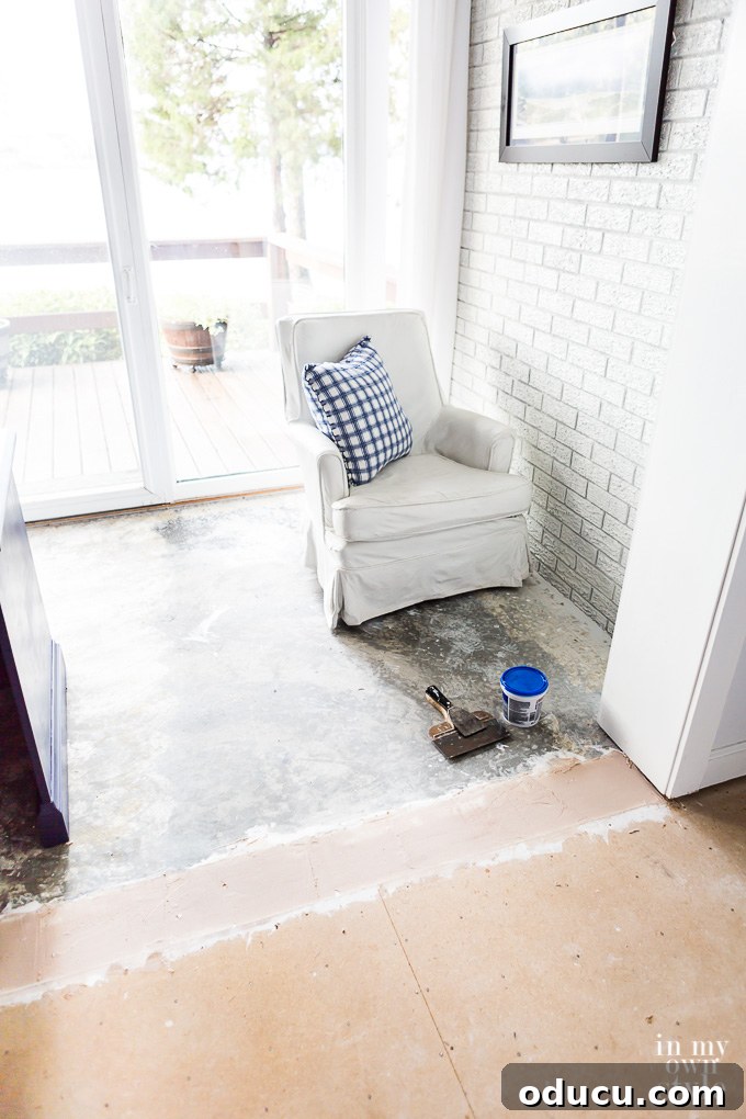Floor Makeover: From Carpet to Laminate Wood 11 Subfloor preparation, showing the area where concrete meets sub-flooring.