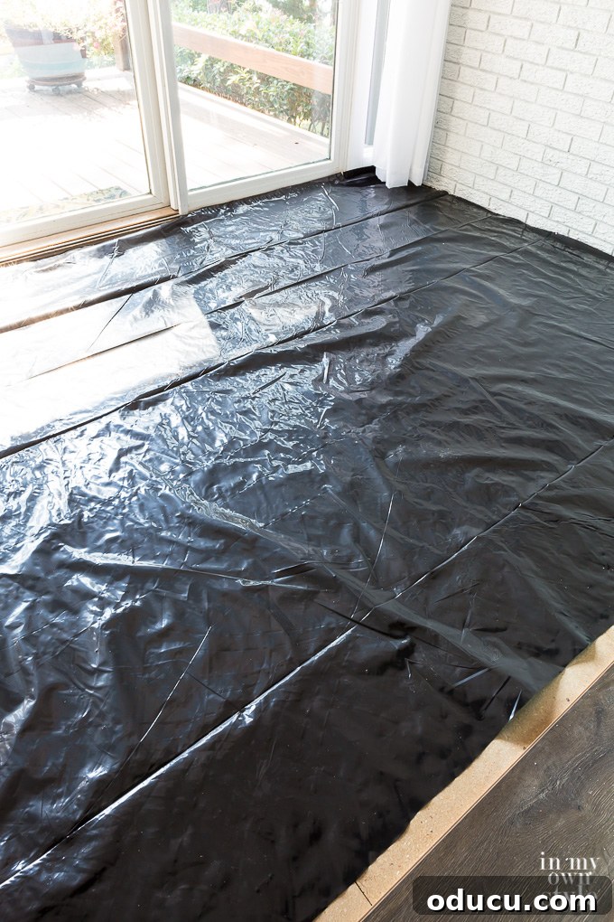 Floor Makeover: From Carpet to Laminate Wood 12 Applying floor leveling compound to create a smooth, even subfloor surface.