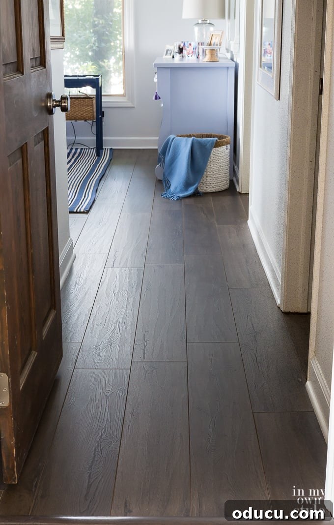 Floor Makeover: From Carpet to Laminate Wood 13 Master Bedroom with Urbanwood Laminate Floor, showcasing the chosen plank direction.