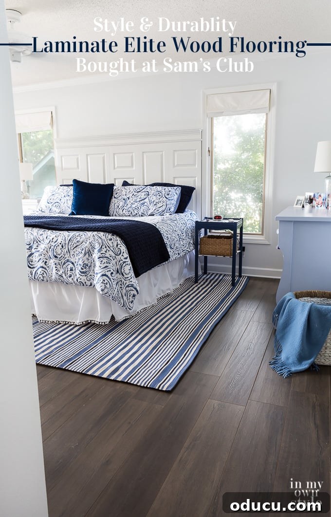 How to install wood laminate flooring from Select Surfaces bought at Sam's Club. The wood laminate flooring is perfect for the DIYer since it is very affordable, durable and easy to install. My husband who has installed luxury vinyl plank in 4 rooms found this easier to install. We love it. See more photos of how it looks, the color we used and more over on In My Own Style blog. #Laminate #laminateflooring #samsclub #bedroomflooring #woodflooringoptions #selectsurfaces After photo showing how new Urbanwood laminate flooring looks in a blue and white bedroom, complete with decor.