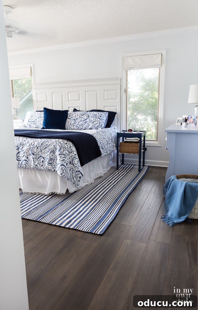 Floor Makeover: From Carpet to Laminate Wood 2 Before and After Bedroom Flooring makeover, highlighting the dramatic change from carpet to laminate.