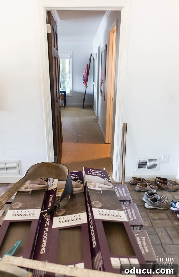 How to install wood laminate flooring from Select Surfaces Getting ready to install wide plank laminate wood flooring in a bedroom.