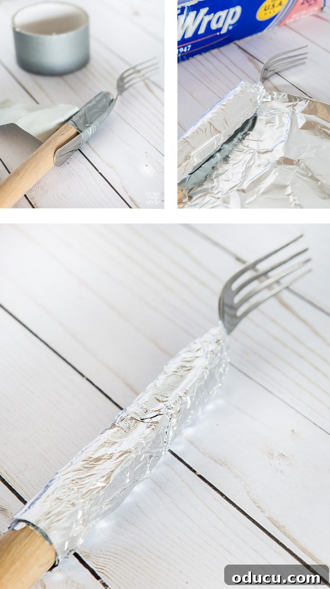 Step-by-Step Tutorial: Make Your Own DIY Marshmallow and Hot Dog Roasting Forks A step-by-step visual tutorial showing how to construct a DIY marshmallow or hot dog roasting fork on a stick, from securing the fork with duct tape to wrapping it with aluminum foil. Clear instructions for an easy and effective campfire tool.